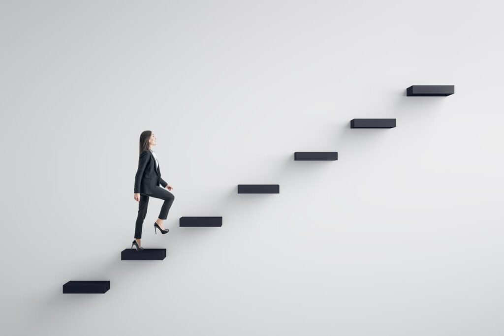 business leader walking up a flight of stairs indicating growth
