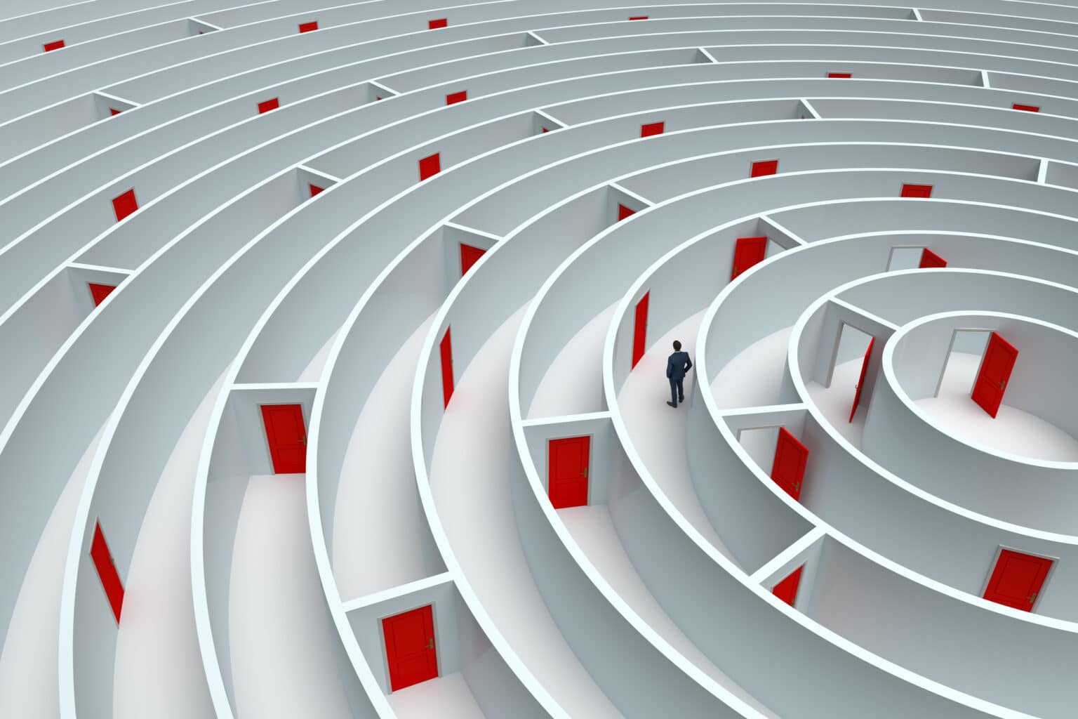 A man standing in a maze with many different red doors.