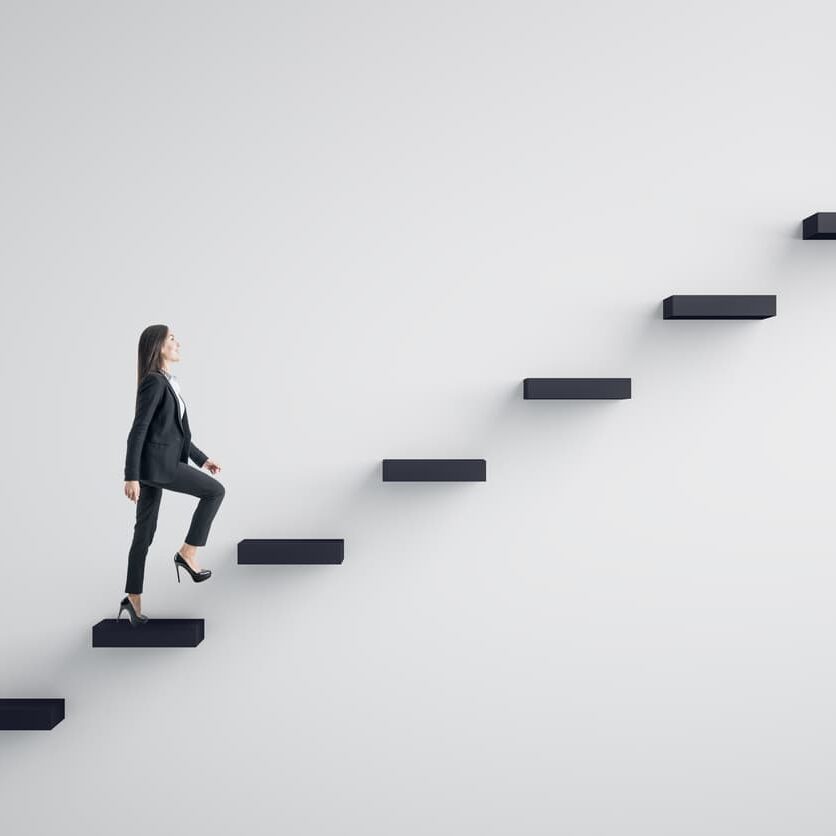 business leader walking up a flight of stairs indicating growth